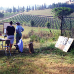 A painting class overlooks a vineyard